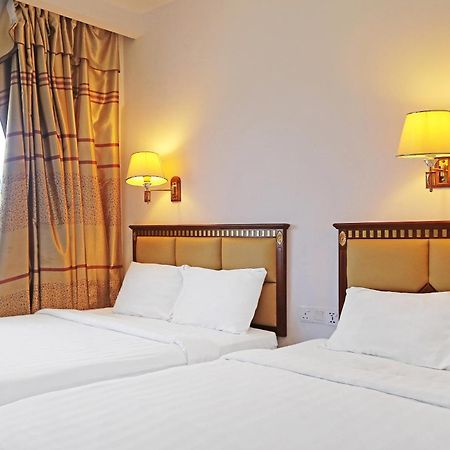 Super Oyo 90464 Borneo Suites Hotel Кота-Кінабалу Екстер'єр фото